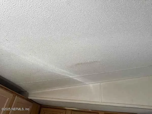 a view of a backyard with sitting area