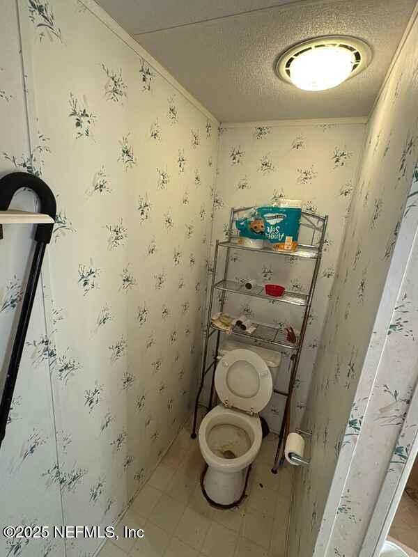 12491 Northeast 88th Lane Bronson, FL 32621 - Photo 97 of 183 a bathroom with a sink toilet and shower