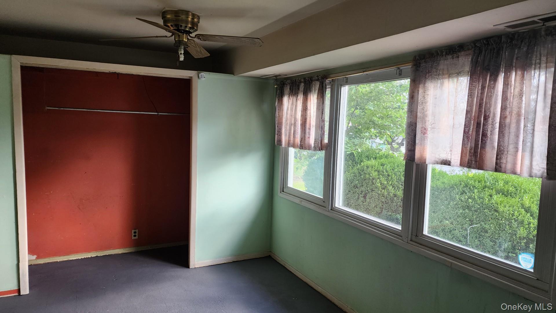 32 Bloomer Road Brewster, NY 10509 - Photo 11 of 18 Unfurnished bedroom with a ceiling fan and a closet