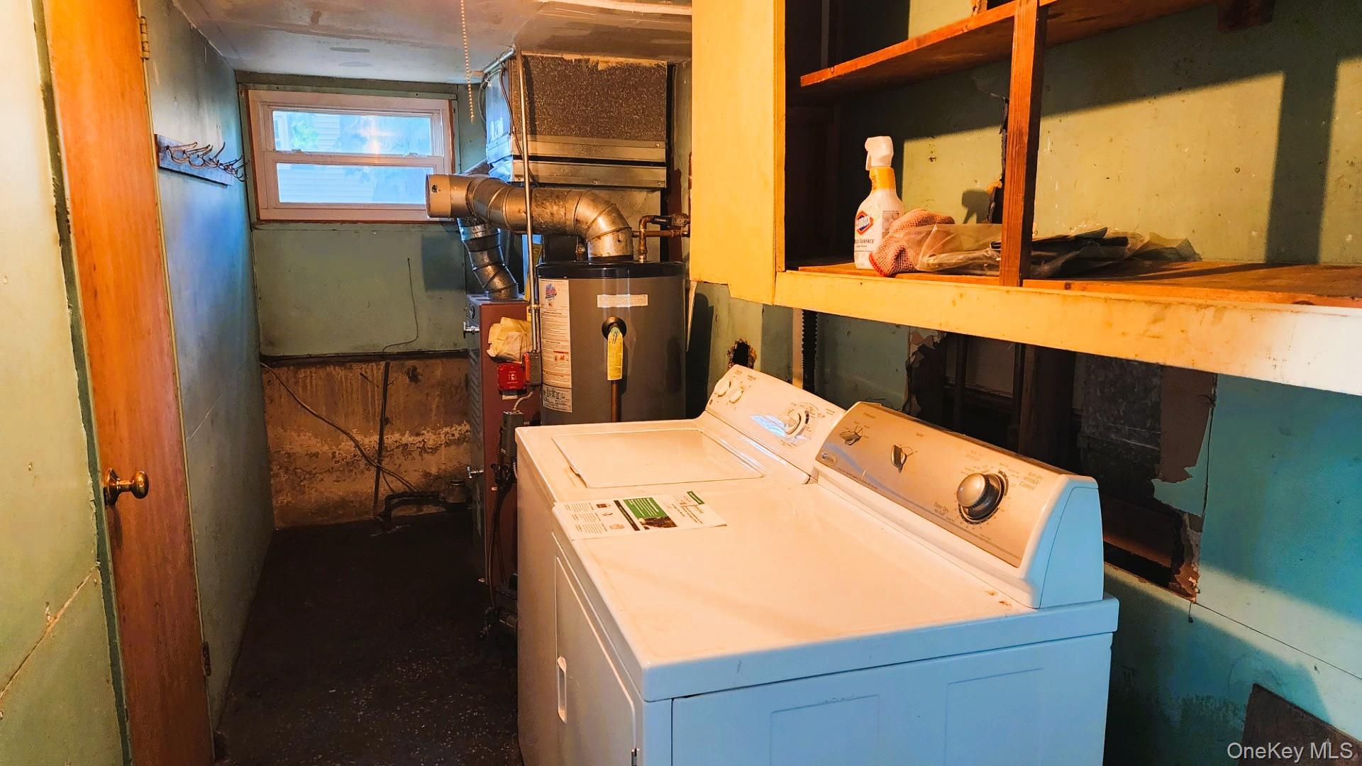 32 Bloomer Road Brewster, NY 10509 - Photo 16 of 18 Laundry room featuring gas water heater and washing machine and clothes dryer