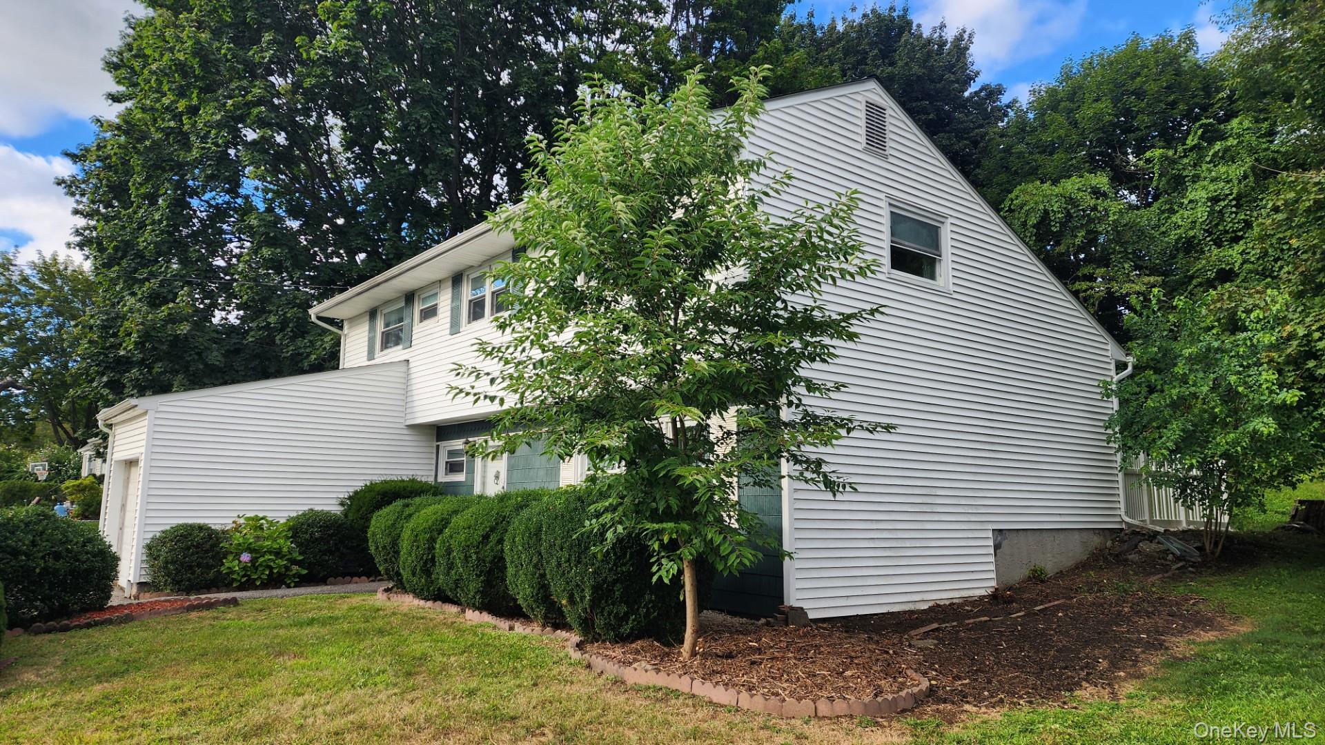 32 Bloomer Road Brewster, NY 10509 - Photo 2 of 18 View of property exterior featuring a yard