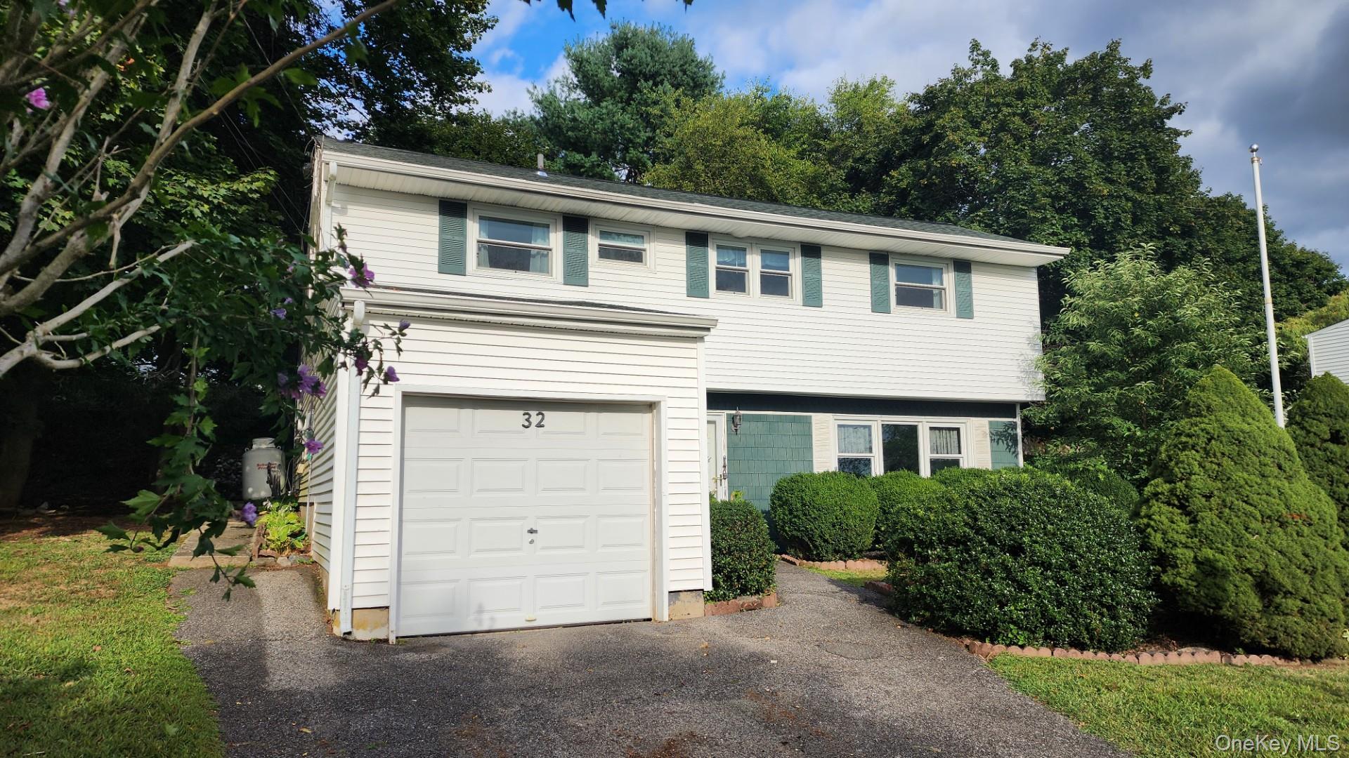 32 Bloomer Road Brewster, NY 10509 - Photo 5 of 18 View of front of home with an attached garage and driveway