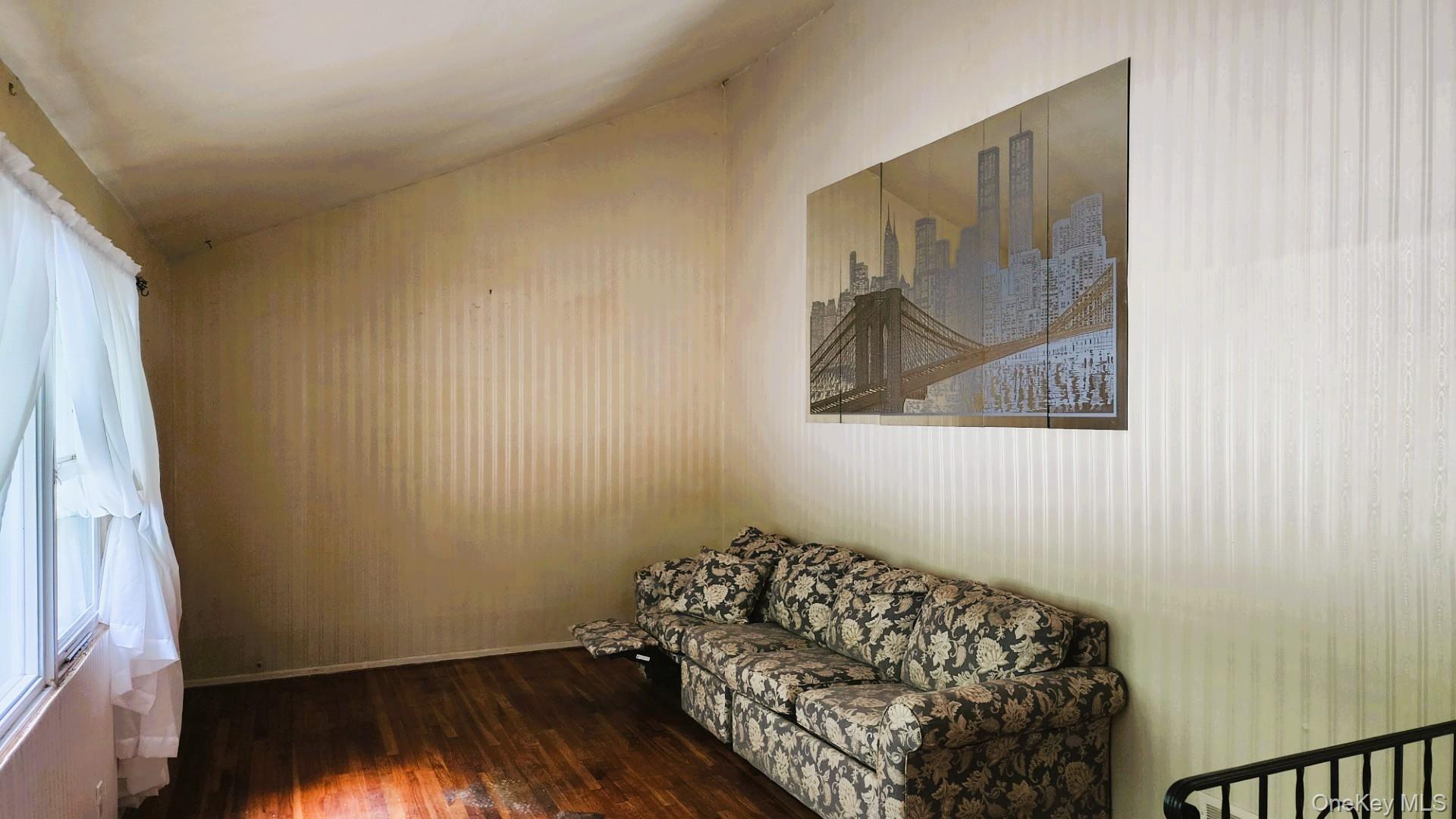 32 Bloomer Road Brewster, NY 10509 - Photo 8 of 18 Living area with dark wood-type flooring and vaulted ceiling