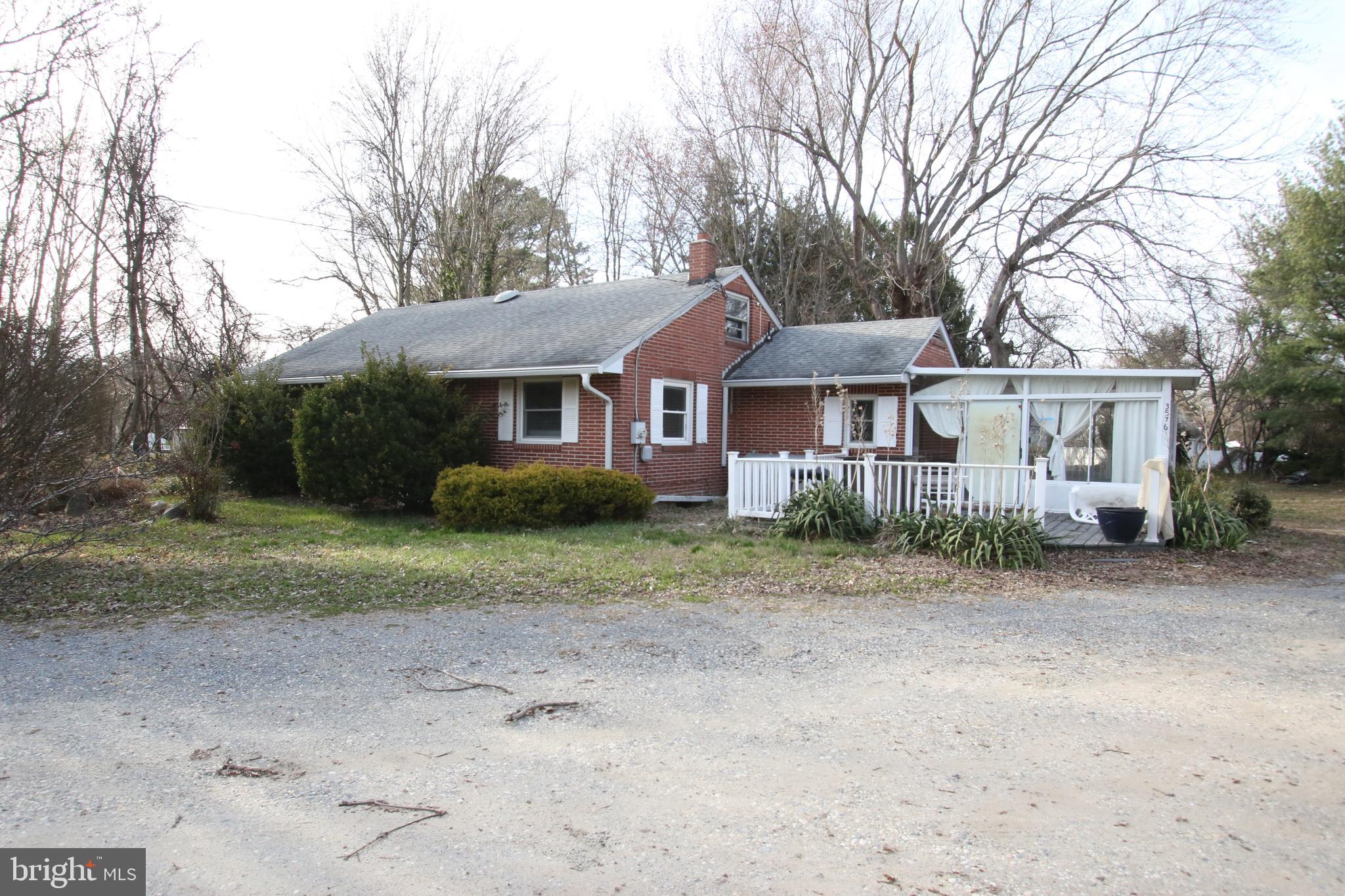 3576 Walnut Shade Road Camden Wyoming, DE 19934 - Photo 11 of 37 a front view of a house with a garden