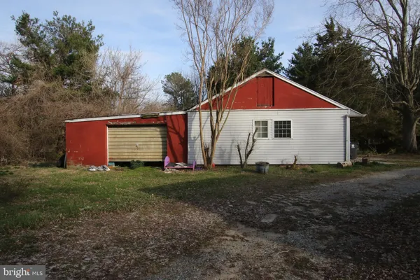 a view of a backyard of the house