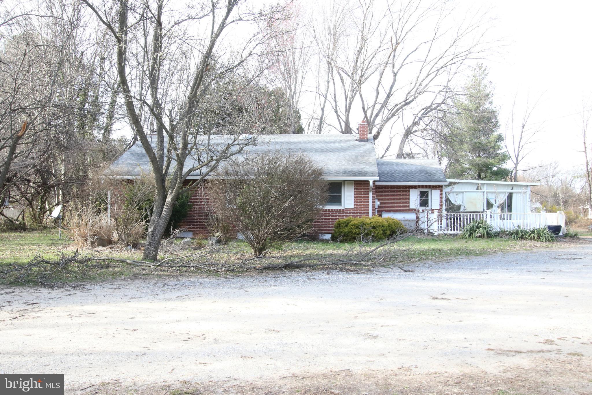 3576 Walnut Shade Road Camden Wyoming, DE 19934 - Photo 6 of 37 a front view of a house with a yard and garage