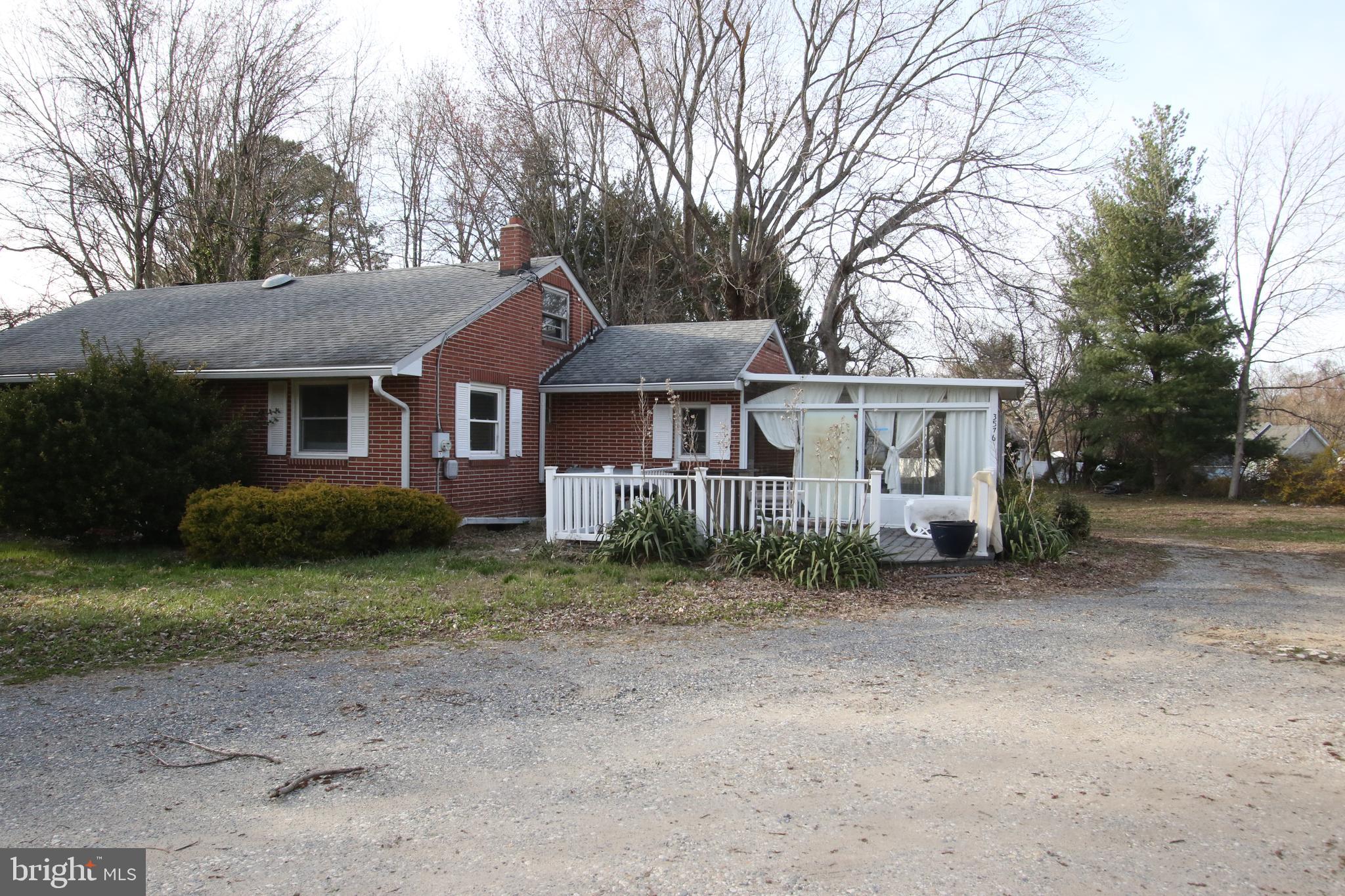 3576 Walnut Shade Road Camden Wyoming, DE 19934 - Photo 9 of 37 a front view of a house with a garden