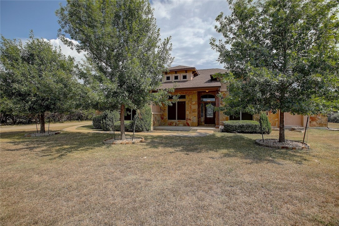 a view of a house with a tree