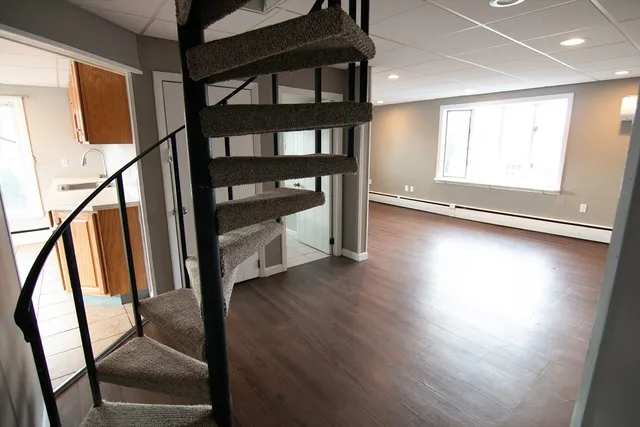 a view of an entryway with wooden floor