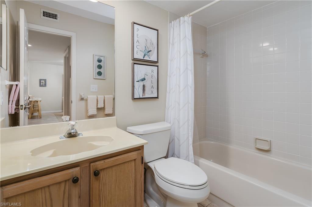 1850 West Crown Pointe Boulevard, Unit A103 Naples, FL 34112 - Photo 15 of 23 Guest Bath