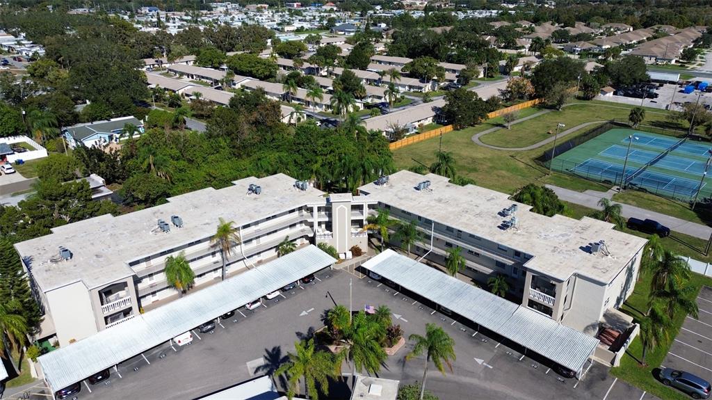 952 Virginia Street, Unit 107 Dunedin, FL 34698 - Photo 12 of 15 an aerial view of a house with a yard