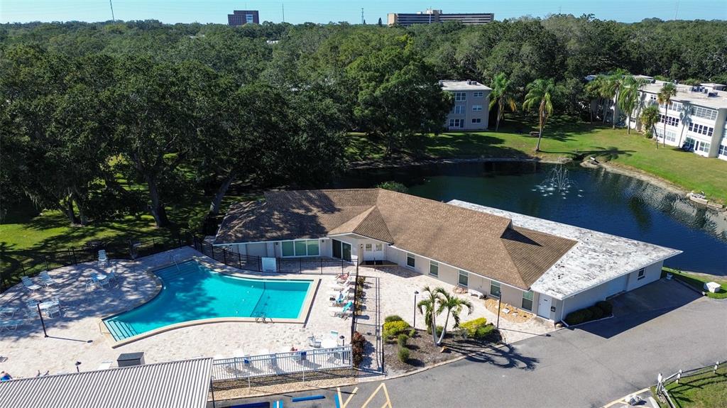 952 Virginia Street, Unit 107 Dunedin, FL 34698 - Photo 13 of 15 an aerial view of a house with garden space and lake view