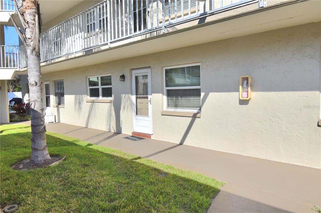 952 Virginia Street, Unit 107 Dunedin, FL 34698 - Photo 3 of 15 a view of a house with a park