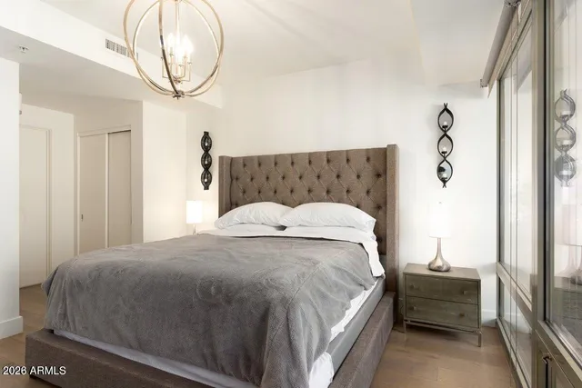 a bedroom with a bed and a window