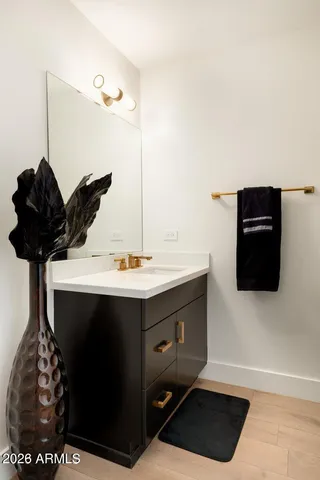 a bathroom with a sink and a mirror