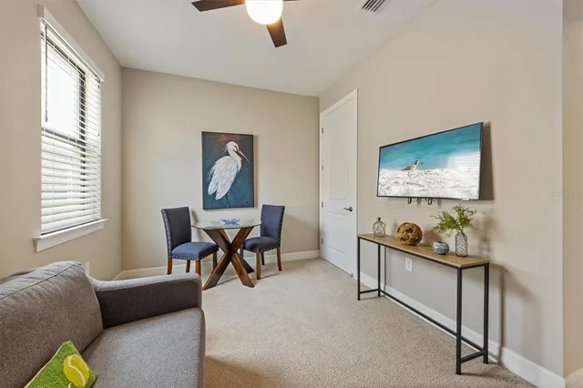 a living room with furniture and a window