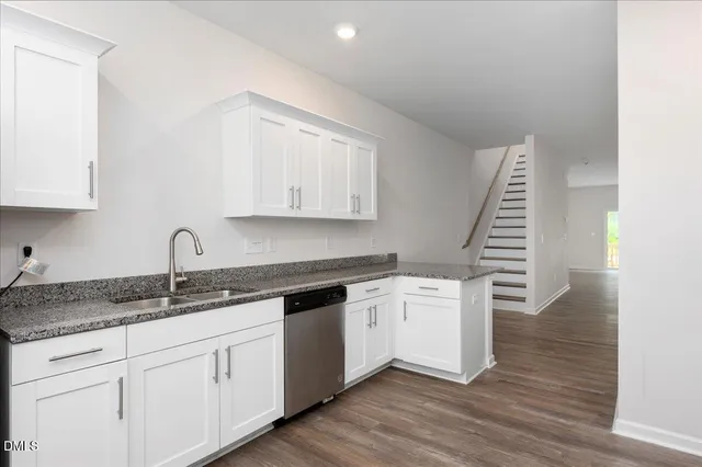 a kitchen with a sink and cabinets