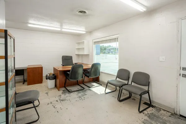 a bedroom with two beds and with chair