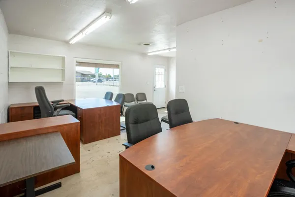 a bedroom with a workspace