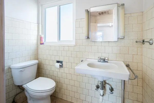 a view of a bathroom from a hallway