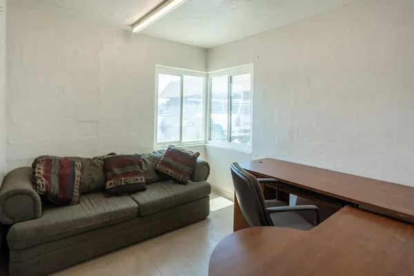 a bedroom with a bed and cabinets