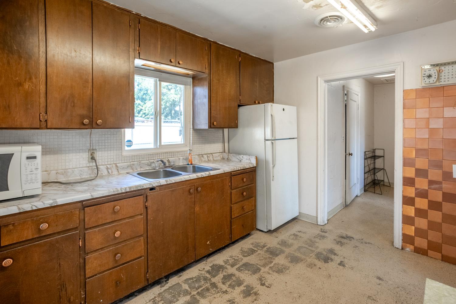 33 East Gridley Road Gridley, CA 95948 - Photo 41 of 50 a kitchen with stainless steel appliances granite countertop a refrigerator and a sink