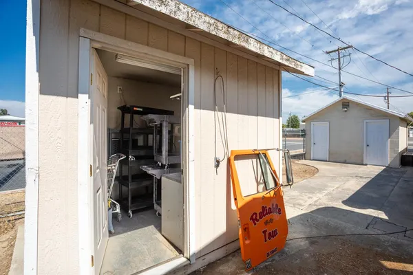 a kitchen with a stove and a refrigerator