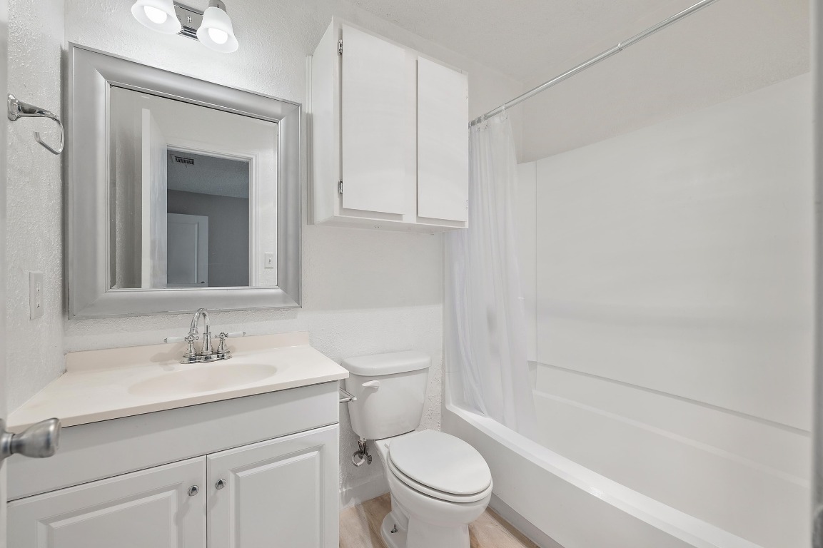 16016 Fitchburg Circle Pflugerville, TX 78660 - Photo 15 of 22 a bathroom with a sink toilet and shower