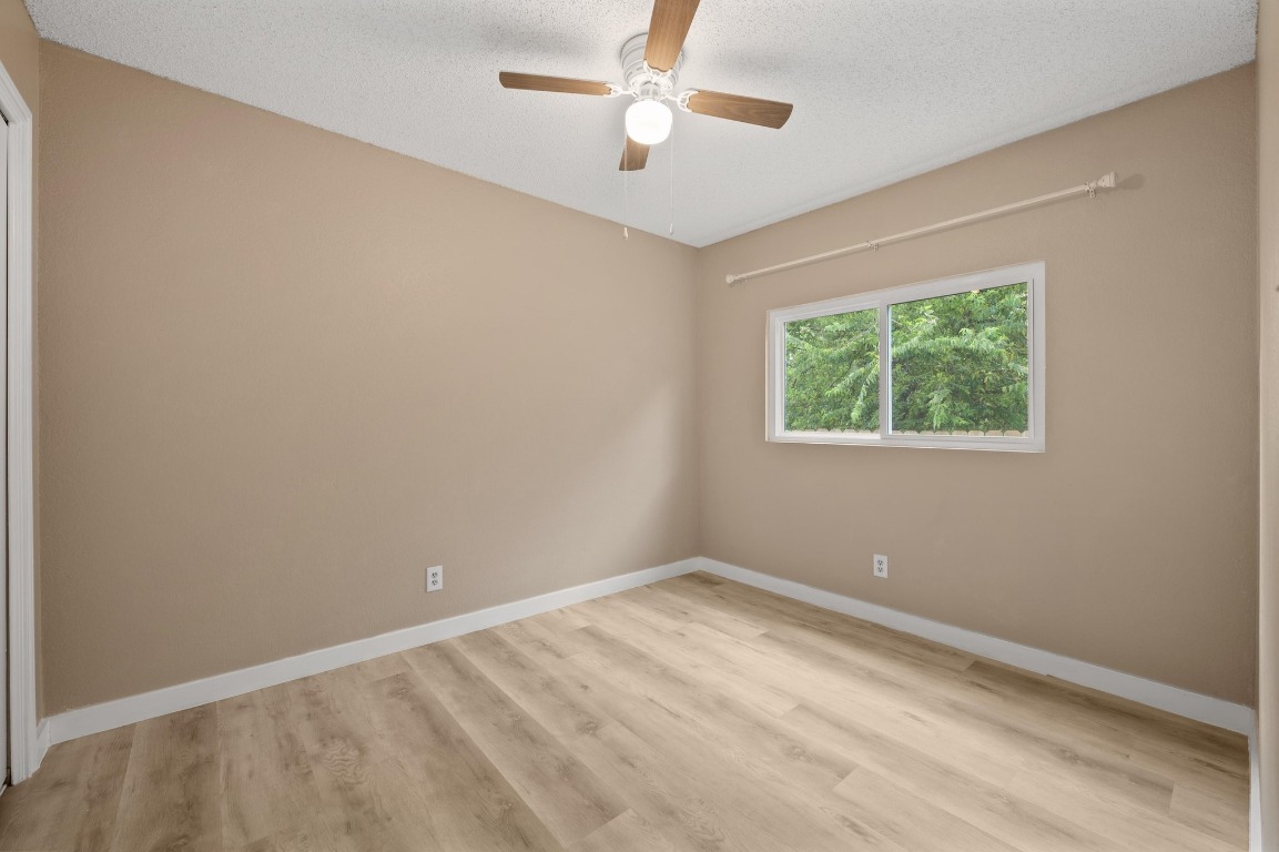 16016 Fitchburg Circle Pflugerville, TX 78660 - Photo 19 of 22 an empty room with a window and a fan