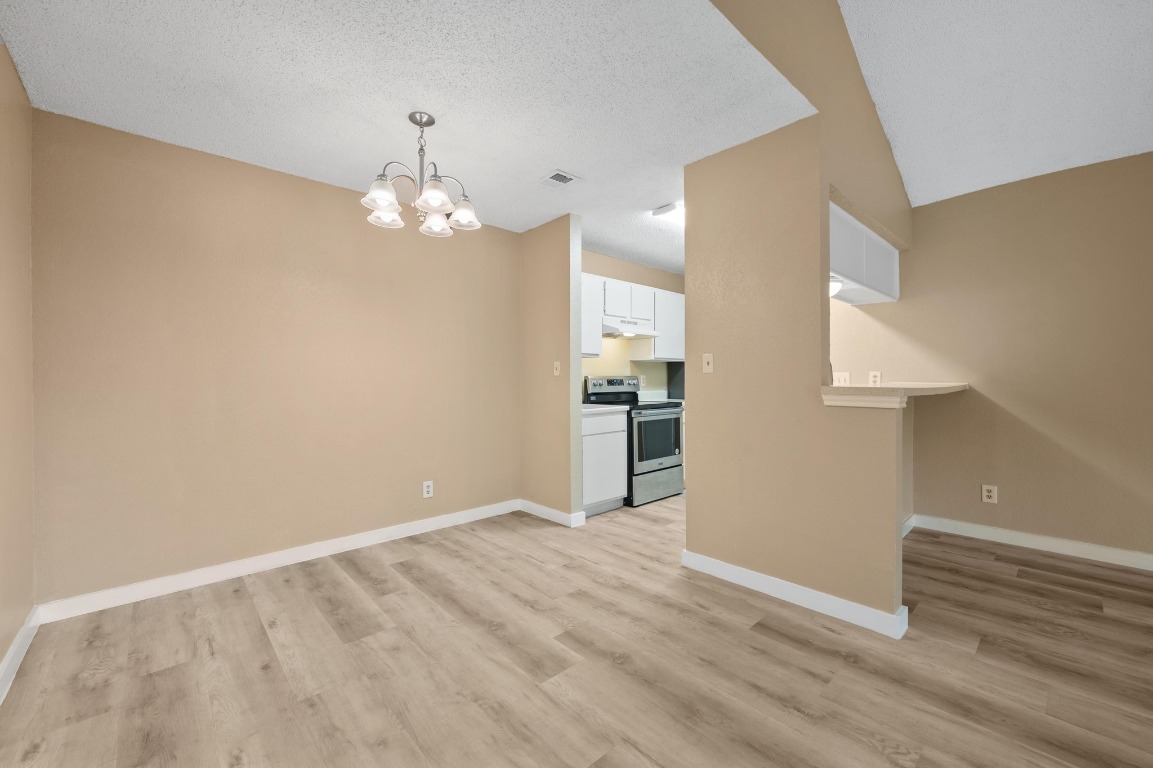 16016 Fitchburg Circle Pflugerville, TX 78660 - Photo 8 of 22 a view of a kitchen with wooden floor and a sink