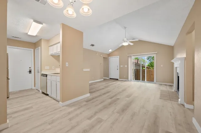 a view of livingroom and hallway with wooden floor