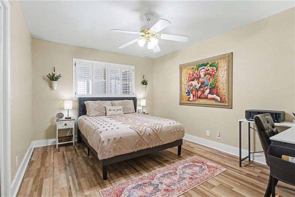1833 Tom Odum Road Vidalia, GA 30474 - Photo 31 of 59 a bedroom with a bed and a painting on the wall