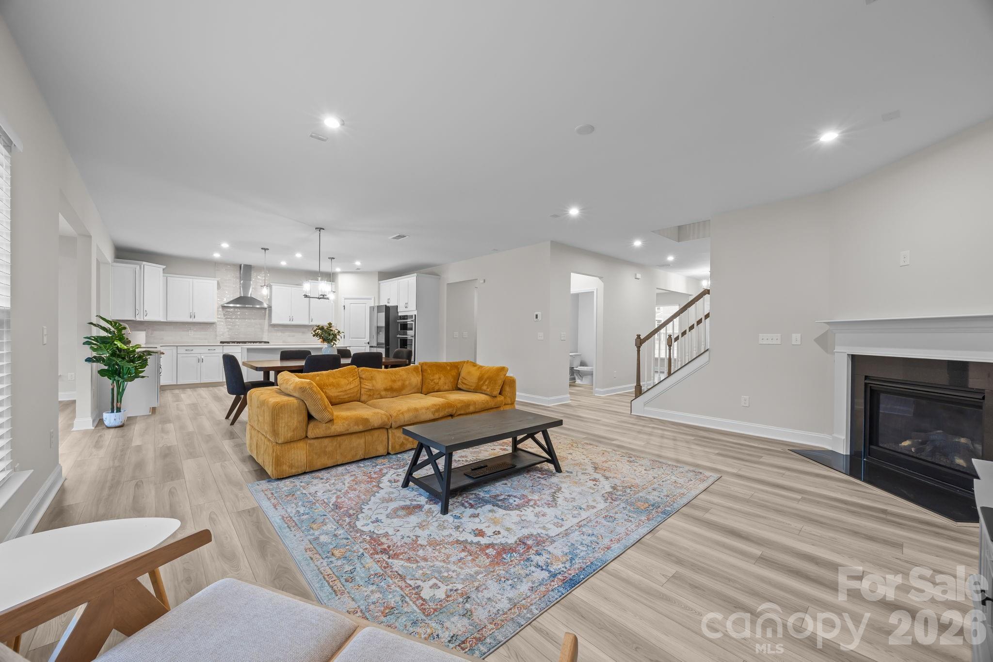 11224 Glasden Road Charlotte, NC 28278 - Photo 14 of 45 a living room with furniture and a fireplace