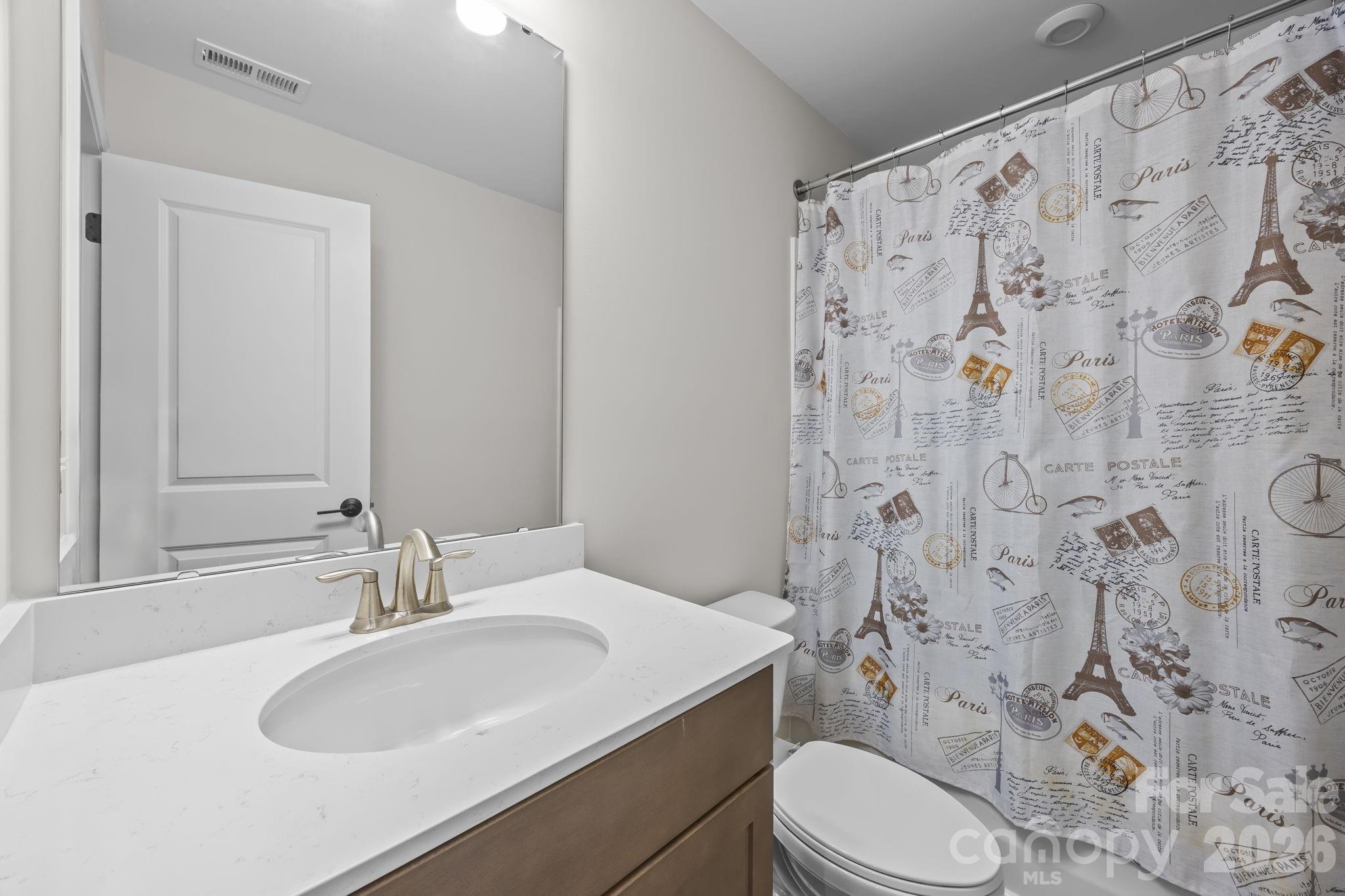11224 Glasden Road Charlotte, NC 28278 - Photo 23 of 45 a bathroom with a sink toilet and shower