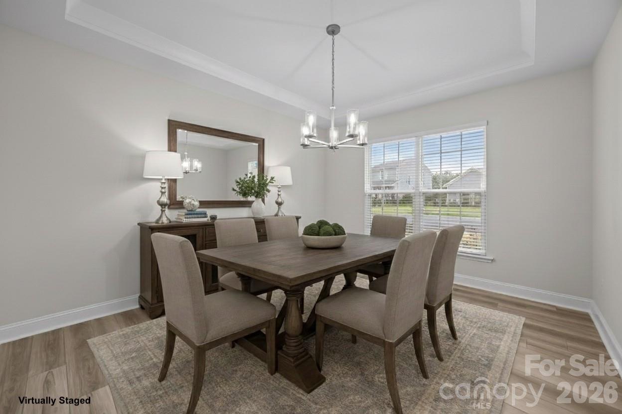 11224 Glasden Road Charlotte, NC 28278 - Photo 4 of 45 a view of a dining room with a table and chairs