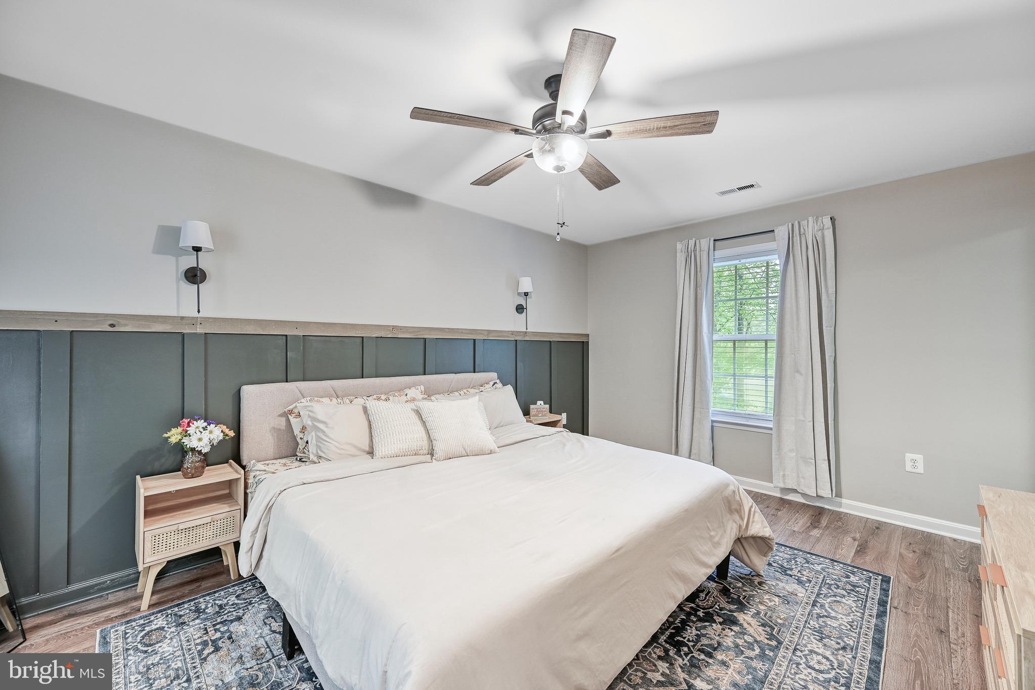 3605 Burton Road Bumpass, VA 23024 - Photo 16 of 39 a bedroom with a bed and a chandelier