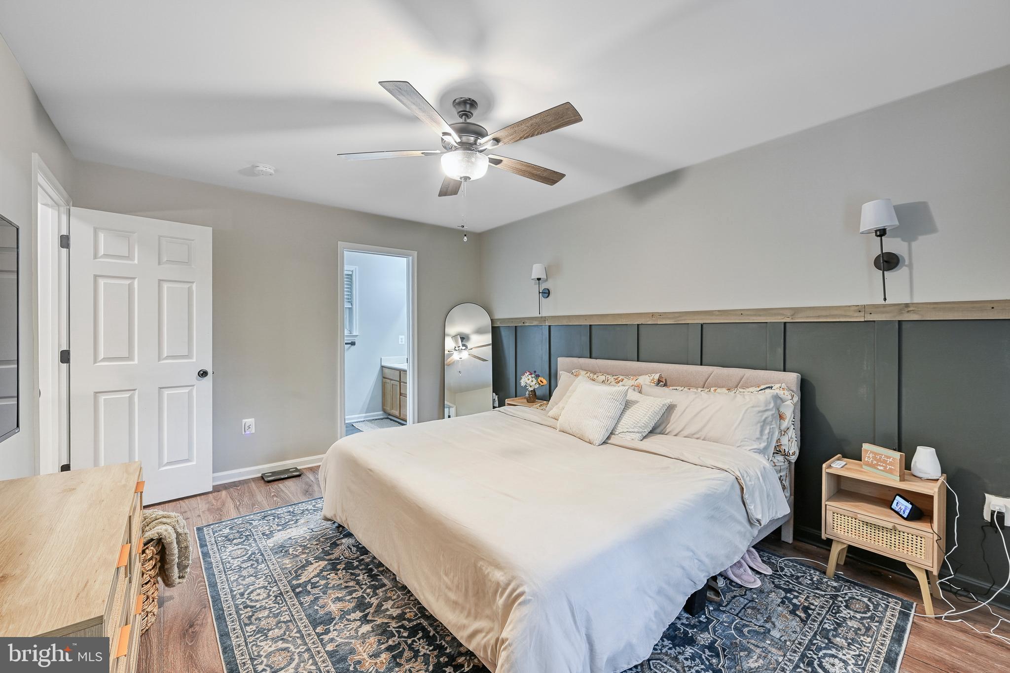 3605 Burton Road Bumpass, VA 23024 - Photo 17 of 39 a bedroom with a bed and a chandelier