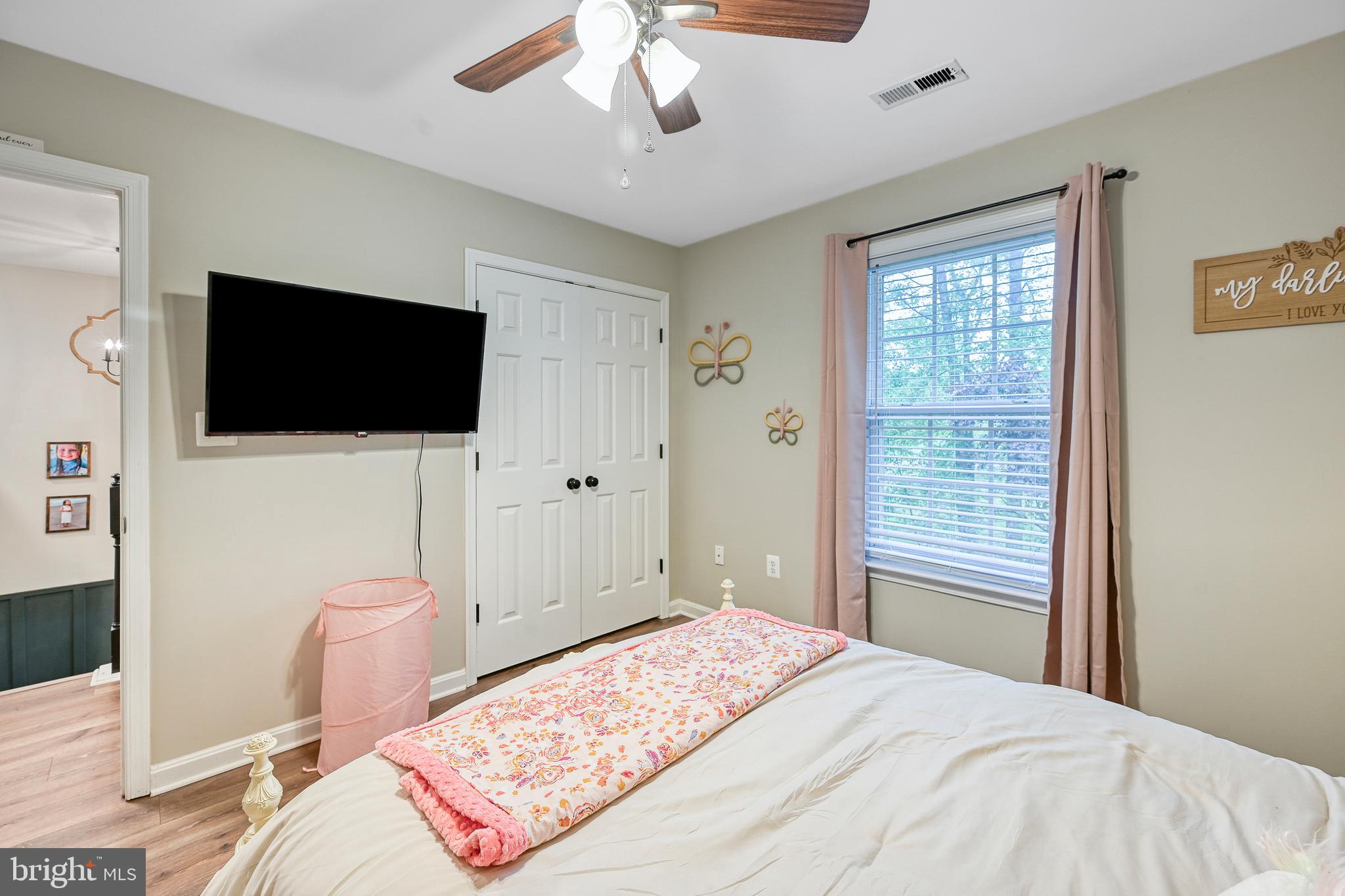 3605 Burton Road Bumpass, VA 23024 - Photo 23 of 39 a bedroom with a bed and a flat screen tv