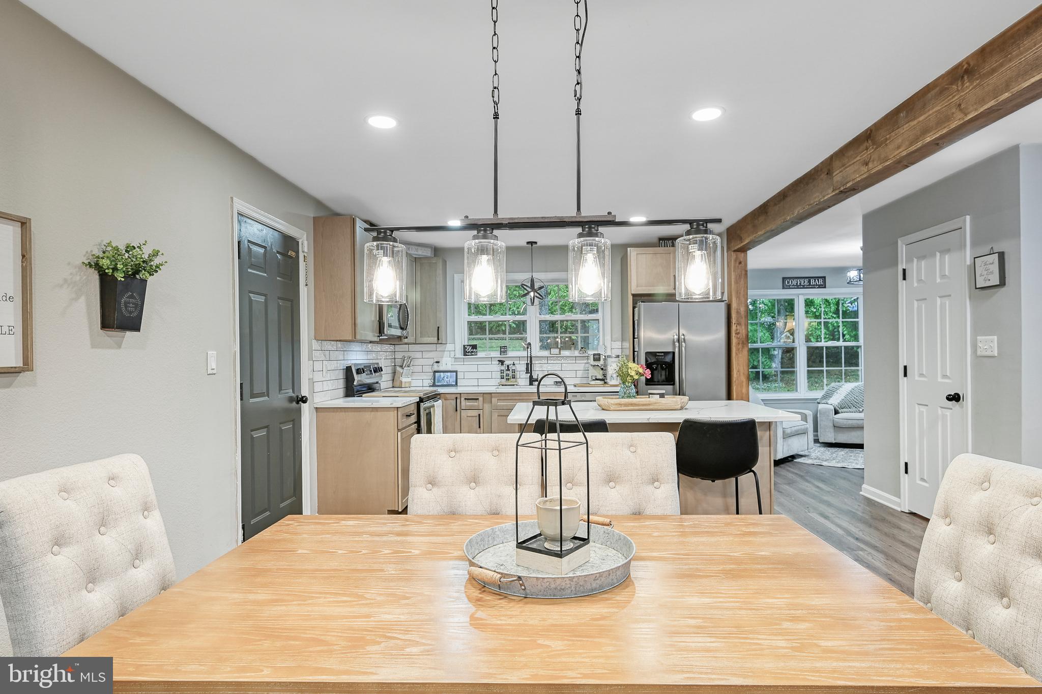 3605 Burton Road Bumpass, VA 23024 - Photo 5 of 39 a living room with kitchen island furniture and a large window