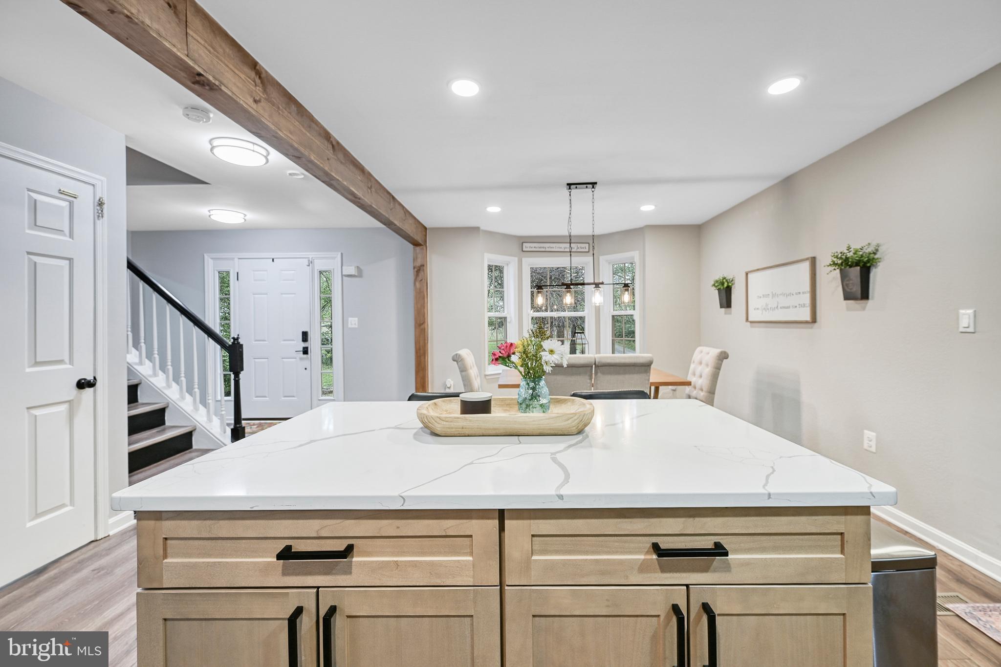 3605 Burton Road Bumpass, VA 23024 - Photo 7 of 39 a kitchen with kitchen island a stove cabinets and wooden floor