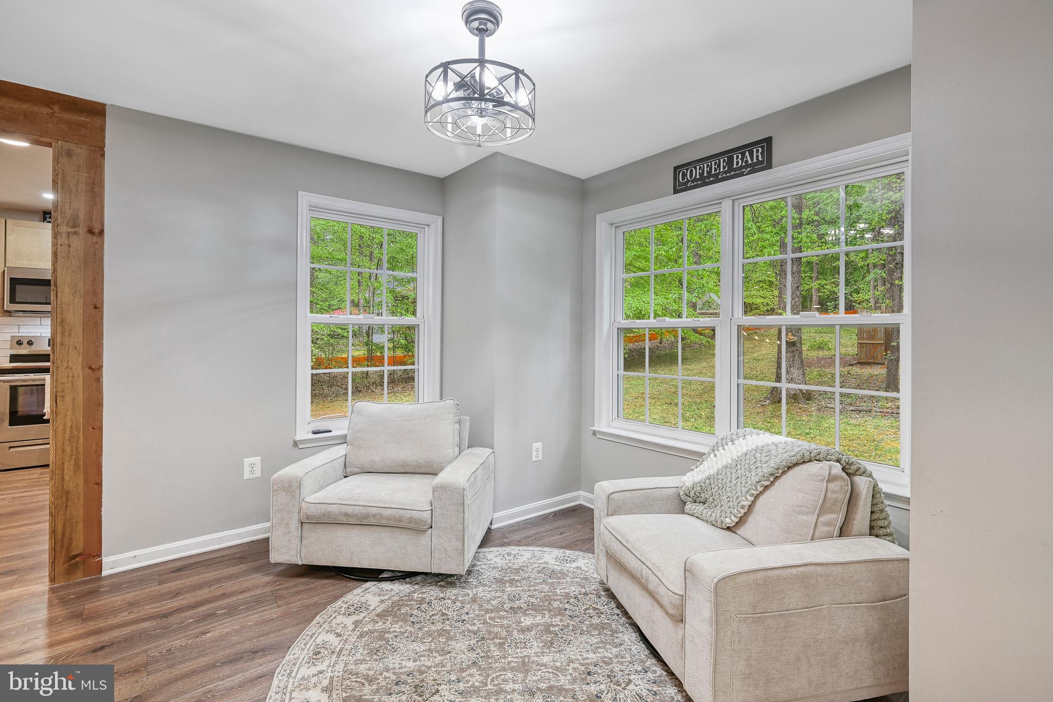 3605 Burton Road Bumpass, VA 23024 - Photo 10 of 39 a living room with furniture and a large window