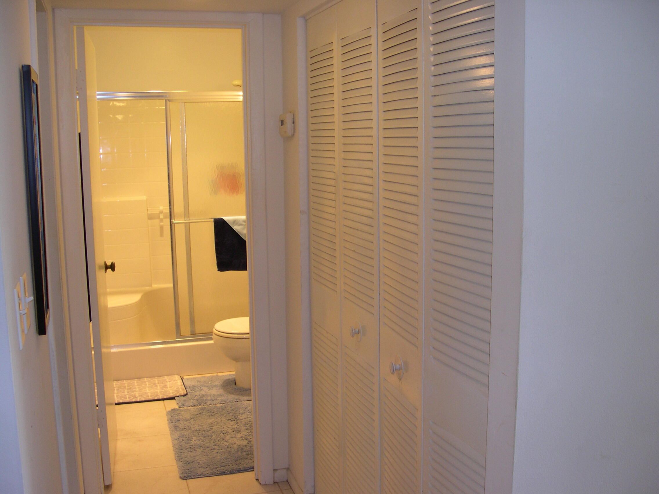 1172 Commodore Court, Unit 204 Fort Pierce, FL 34949 - Photo 24 of 41 Hall to Main bedroom & bath