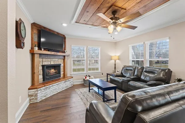 a kitchen with kitchen island granite countertop stainless steel appliances cabinets a sink and a counter top space