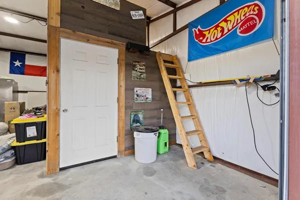 a view of a chairs and table in the patio