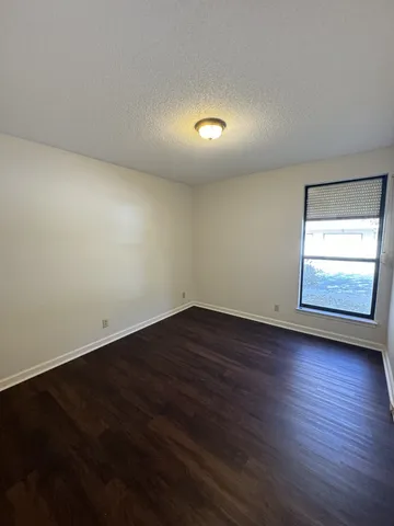 a bathroom with a sink toilet and mirror