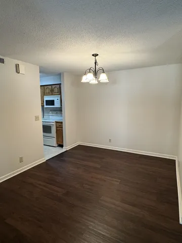 a kitchen with a stove and a refrigerator