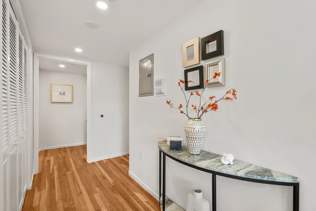 a view of hallway that has closet