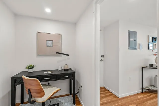 a view of a workspace with furniture