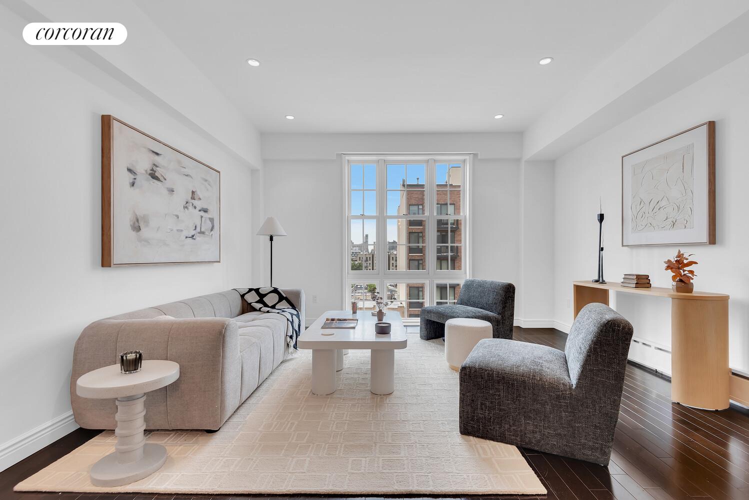 30-11 21st Street, Unit 5C Queens, NY 11102 - Photo 2 of 12 a living room with furniture and a large window