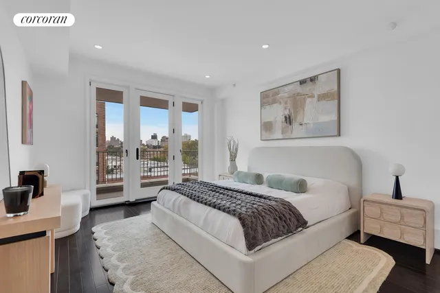 a spacious bedroom with a bed and a couch